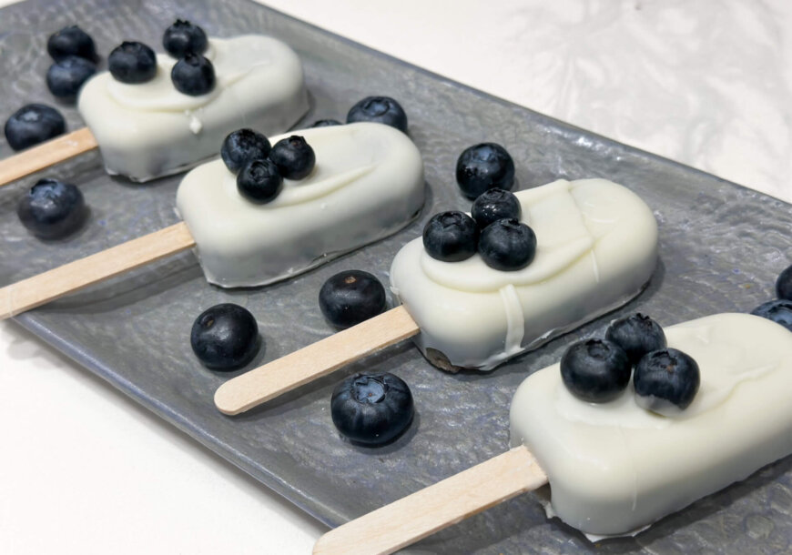 White chocolate dipped blueberry cake pops! Easy recipe from Wish Farms.